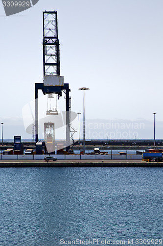 Image of spain crane and harbor pier boat in the blue sky    