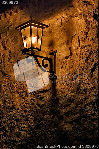 Image of street lamp a bulb in the   wall fussen 