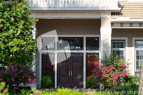 Image of entry surrounded by plants