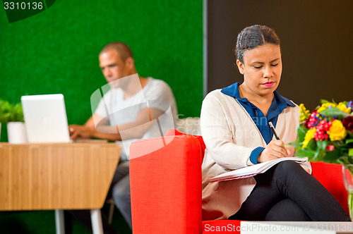 Image of Woman, working in a corporate lobby