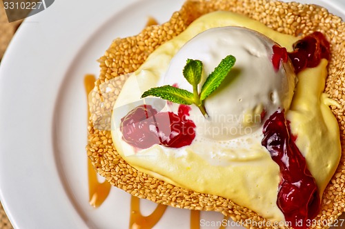 Image of cake with jam ice cream