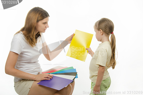 Image of Upset girl takes a picture with yellow