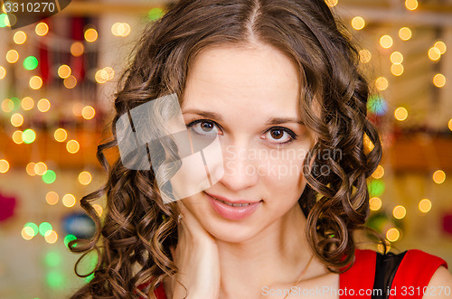 Image of Portrait a girl on background of blurred lights