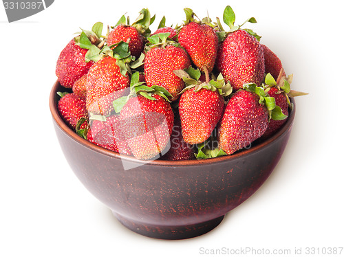 Image of Ripe juicy strawberries in a ceramic bowl top view