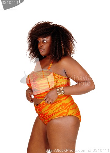 Image of African woman in bikini in profile.