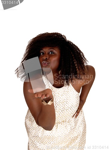 Image of African woman blowing kiss.