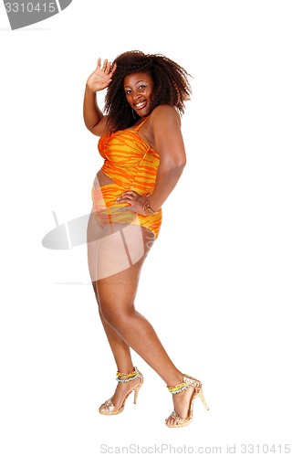 Image of African woman in bikini waiving hand.