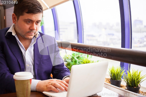 Image of businessman check his email on the computer