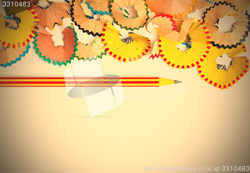 Image of striped pencil and shavings with copy space