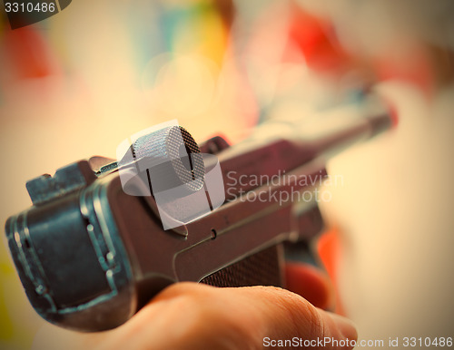 Image of Parabellum automatic pistol in a hand