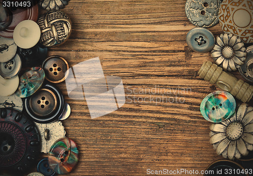 Image of set of vintage buttons on aged boards