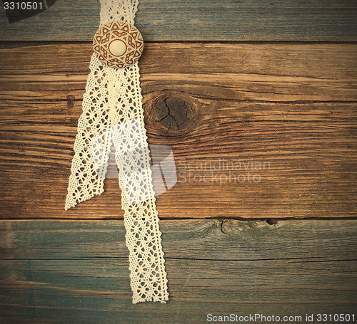 Image of vintage lace with a brooch