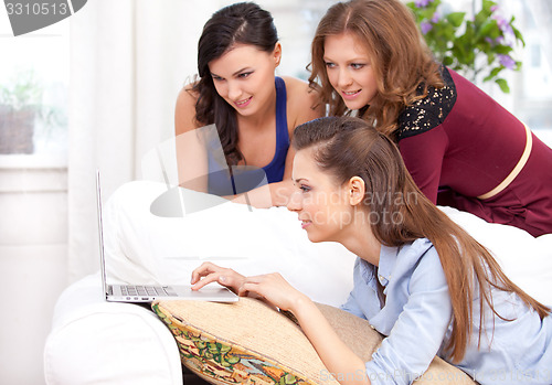 Image of Three girls and a laptop