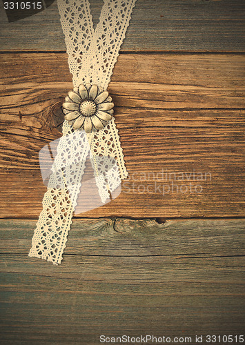 Image of buttons flowers and lace tape