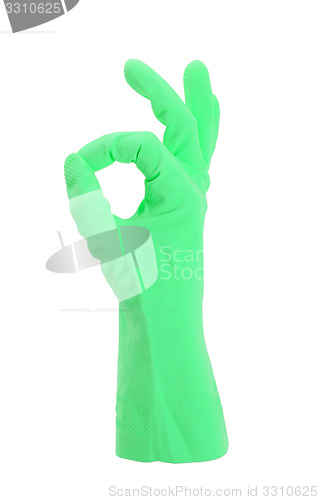 Image of Hand gesturing with green cleaning product glove