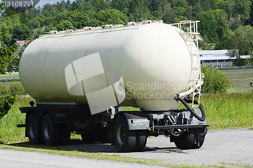 Image of tank car parked in the summer