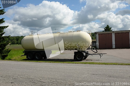 Image of tank car parked in the summer