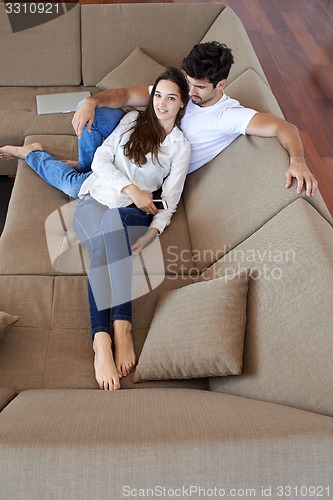 Image of happy young romantic couple have fun arelax  relax at home