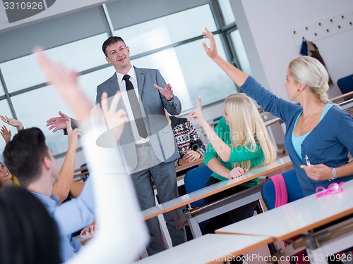 Image of students with teacher  in computer lab classrom