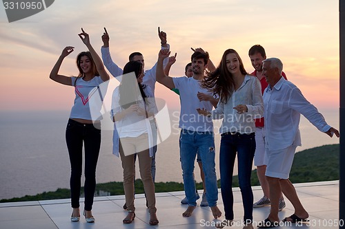 Image of party people  on sunset