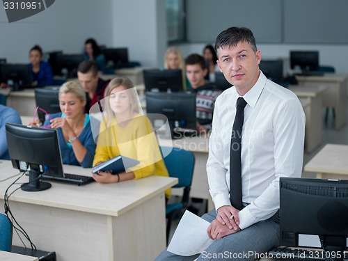 Image of students with teacher  in computer lab classrom