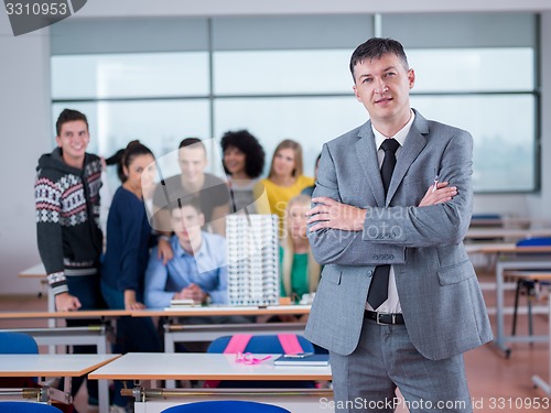 Image of students with teacher  in computer lab classrom