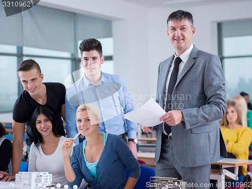 Image of students with teacher  in computer lab classrom