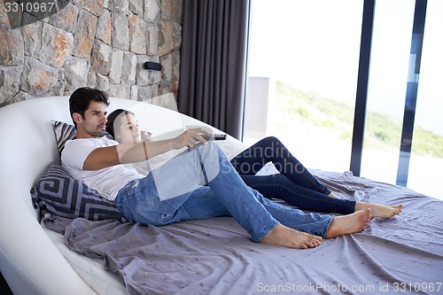 Image of couple relax and have fun in bed