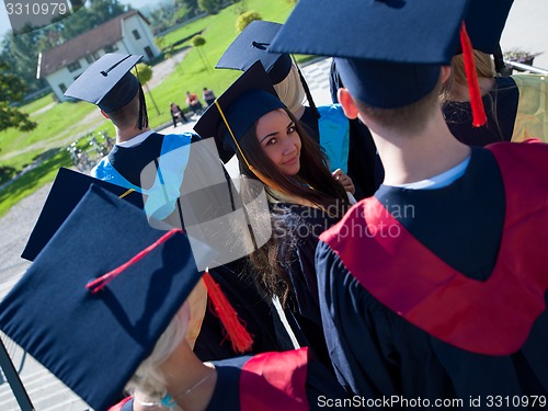 Image of young graduates students group