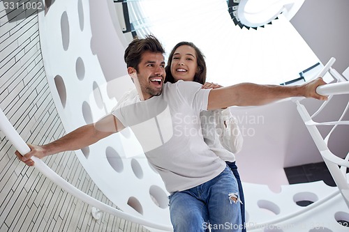 Image of relaxed yung couple at home  stairs