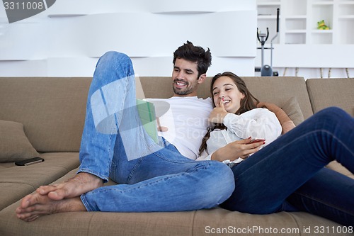 Image of couple at modern home using tablet computer