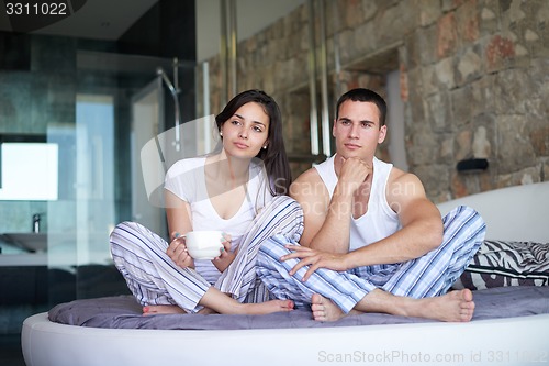 Image of couple relax and have fun in bed