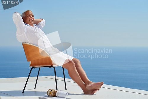 Image of senior man sitting outside