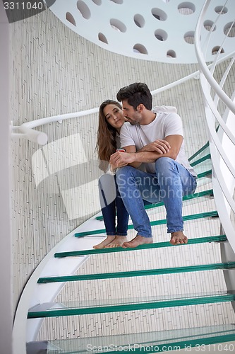 Image of relaxed yung couple at home  stairs