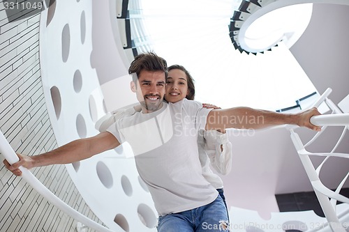 Image of relaxed yung couple at home  stairs