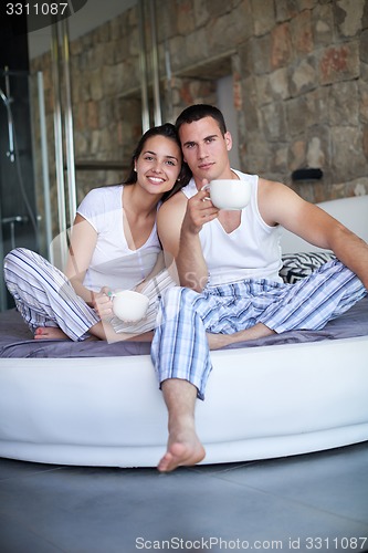 Image of couple relax and have fun in bed