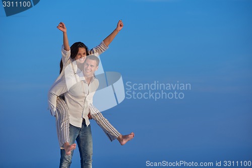 Image of happy young romantic couple have fun arelax  relax at home