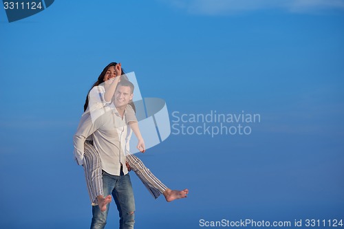 Image of happy young romantic couple have fun arelax  relax at home