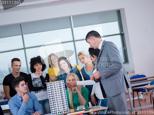 Image of students with teacher  in computer lab classrom