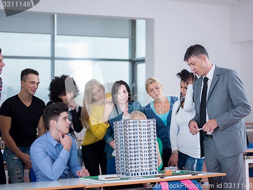 Image of students with teacher  in computer lab classrom