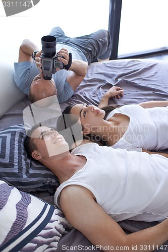 Image of couple relax and have fun in bed