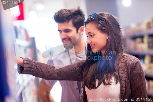Image of couple shopping in a supermarket