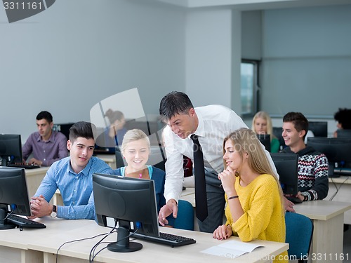 Image of students with teacher  in computer lab classrom