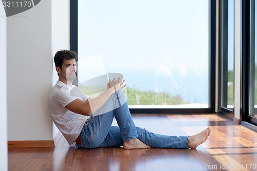 Image of relaxed young couple at home staircase