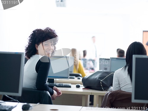 Image of students with teacher  in computer lab classrom