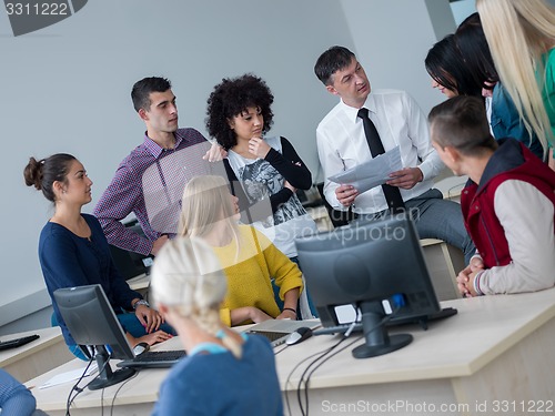 Image of students with teacher  in computer lab classrom