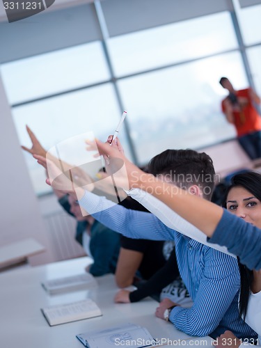 Image of students group raise hands up