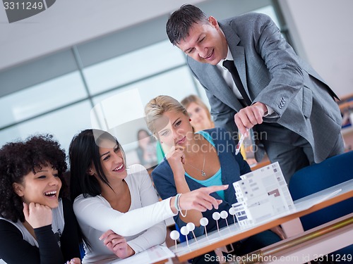 Image of students with teacher  in computer lab classrom