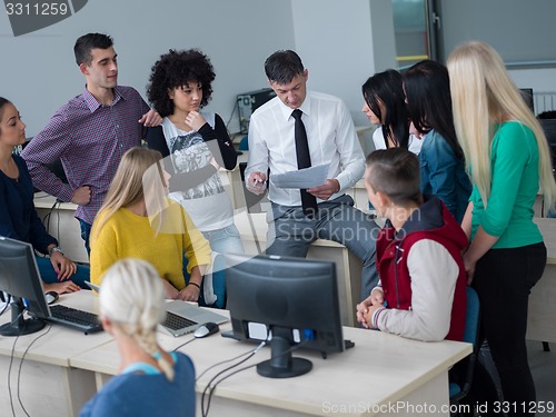 Image of students with teacher  in computer lab classrom