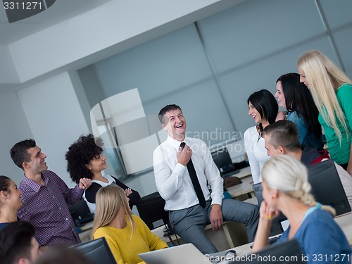Image of students with teacher  in computer lab classrom